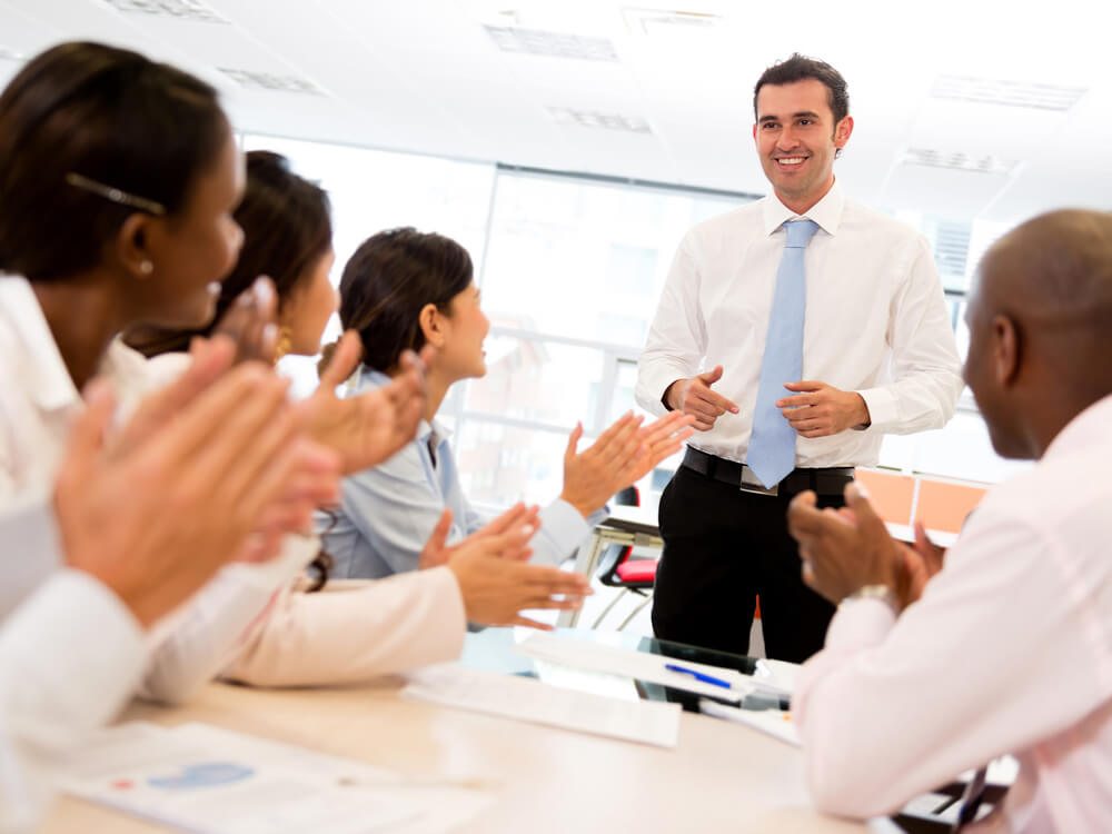 Happy%20man%20making%20a%20successful%20business%20presentation