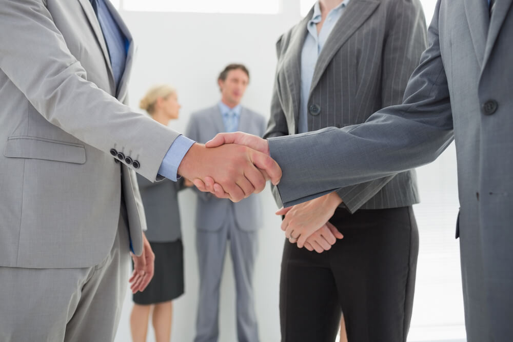 Business people shaking hands in the meeting room