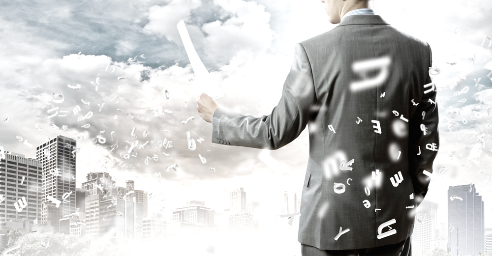 Back view of businessman reading documents in hand-2