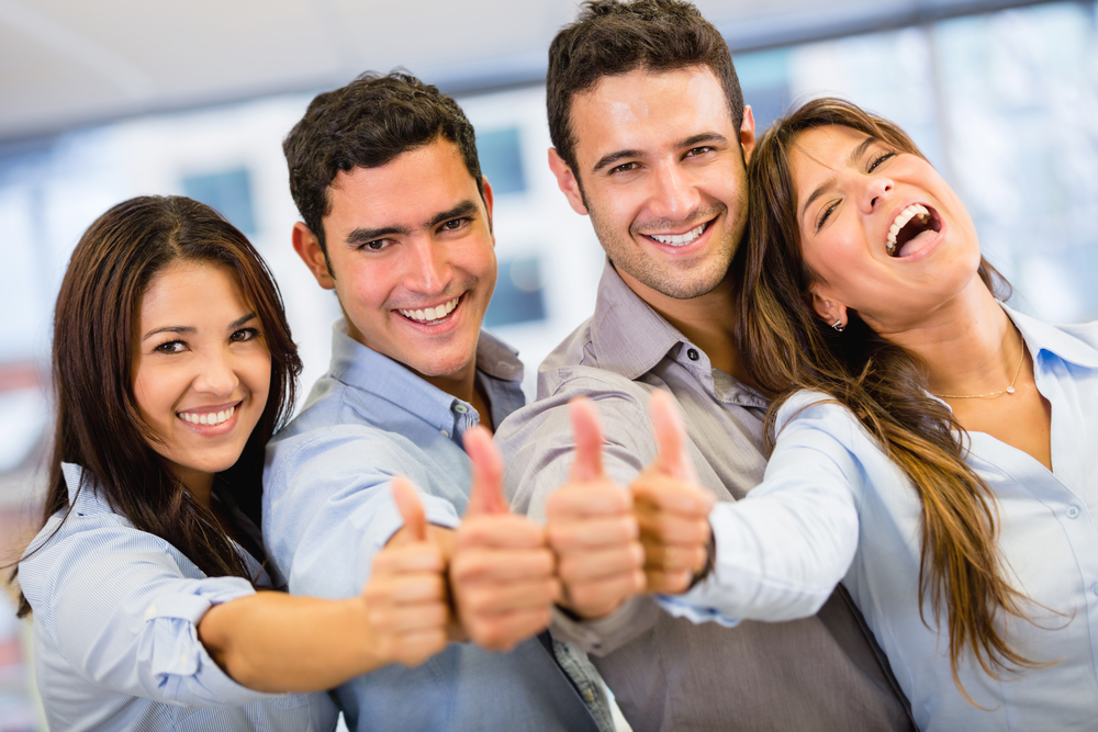 Successful business group with thumbs up at the office